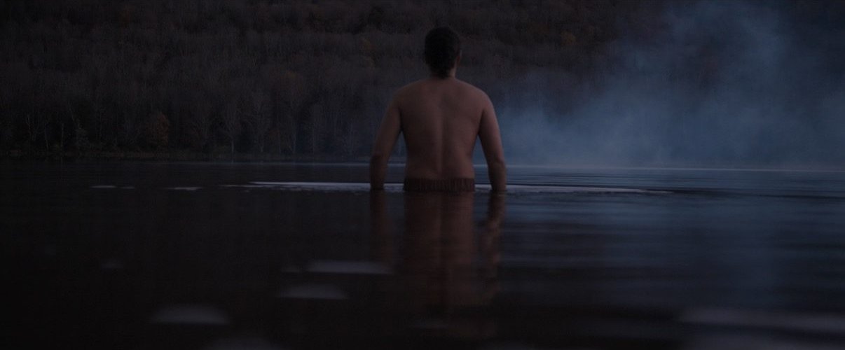 Cynewulf wades into a misty lake at dawn